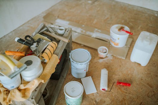 Home Overhead shot of tools and paint supplies for a home renovation project.